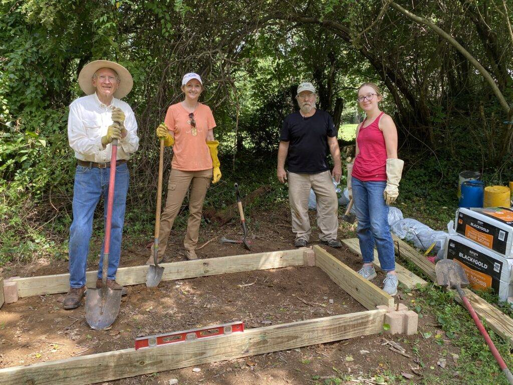 group holding shovels