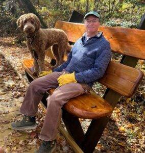 Andy Jones on new bench with dog