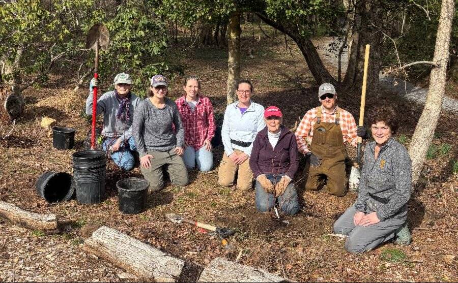 Garden Committee volunteers gathered in the McCoy woods