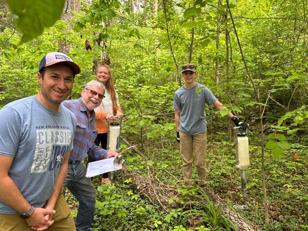 Jordan Gianos, Tom Voychehovski, Beth Myers, and Benjamin Horne treating McCoy's green ash trees for emerald ash borer